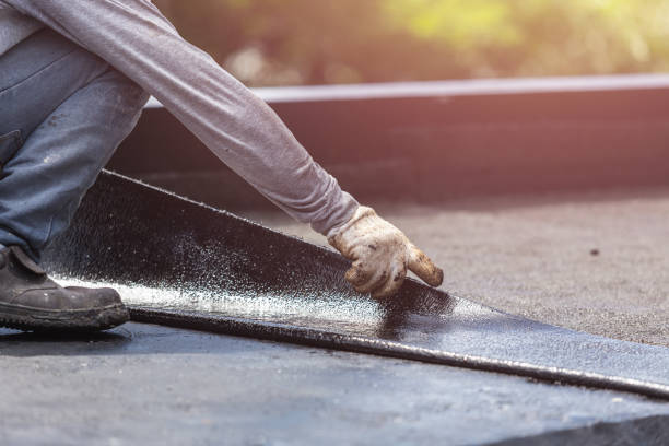 Professional Basement Waterproofing technician working in Andrews, NC